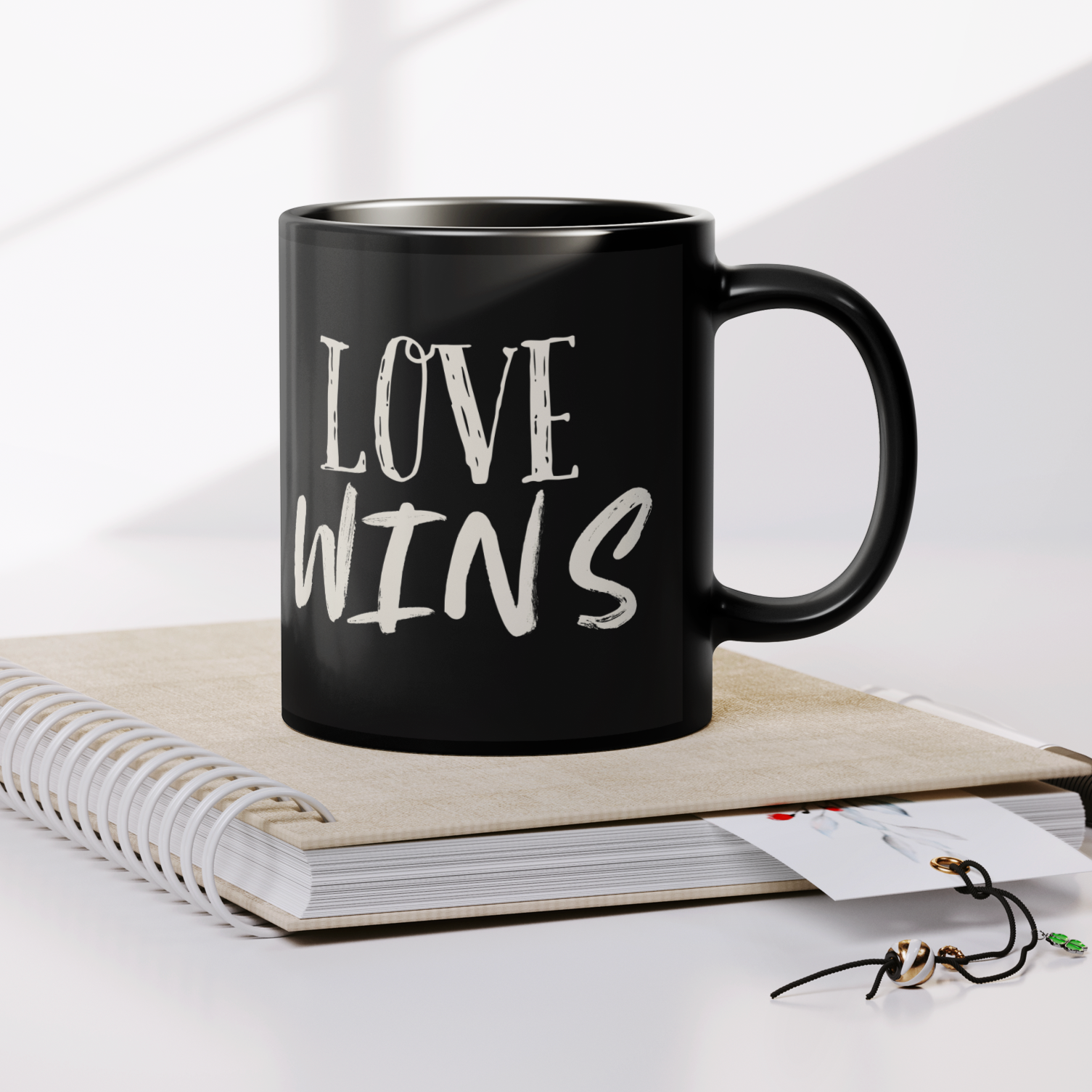 LOVE_WINS_Statement_Mug_Lifestyle_Notebook_Mockup.png