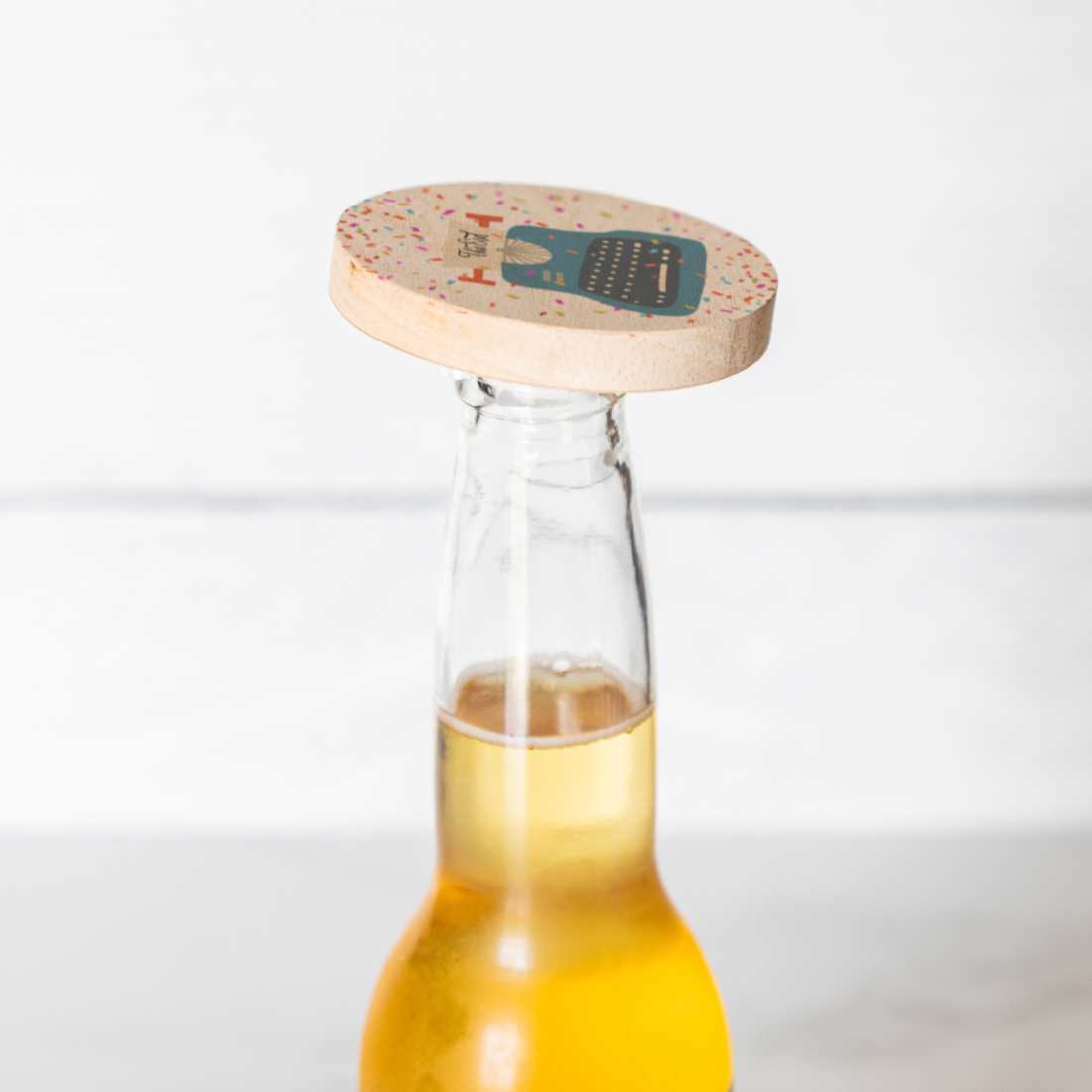 The_End_Bottle_Opener_Bottle_Use_Mockup.png